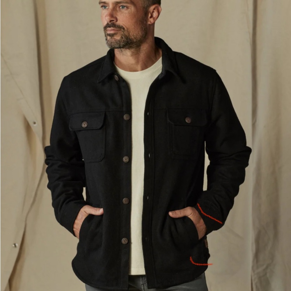 The Normal Brand Men's Black Workwear Jacket with plaid lining.